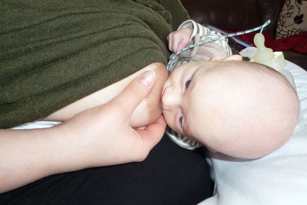 Baby feeding in a rugby hold