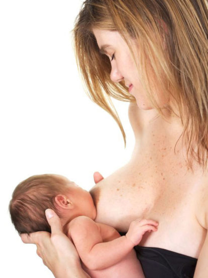 baby held cross-cradle to breastfeed