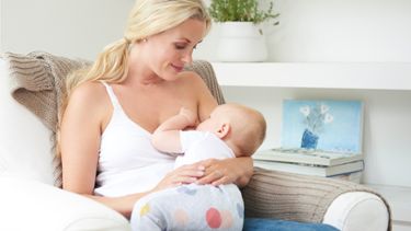 a mother breastfeeding her baby